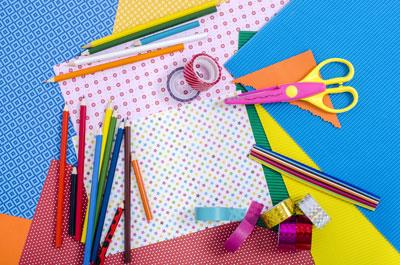 colorful paper and craft supplies on the table